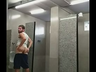 I almost got caught exposing myself in the gym bathroom, and the guys almost caught me.